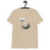 Sand color t-shirt that has an image of a grey rock that is holding a sign. The sign says 'I Rock.' The image is printed on the front of the shirt.