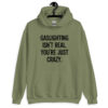 Military green hoodie sweatshirt with the text 'Gaslighting isn't real. You're just crazy.' printed on the front in bold distressed font.