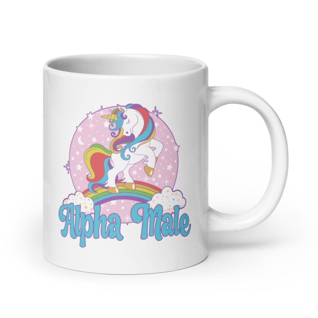 White ceramic mug with funny pastel rainbow unicorn graphics and the words Alpha Male printed on both sides.