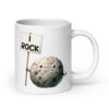 White ceramic mug that has an image of a grey rock that is holding a sign. The sign says 'I Rock.' The image is printed on both sides of the mug.