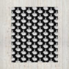 Throw blanket with image of middle finger silhouette printed all over. The blanket is black and the graphic is white.