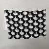 Throw blanket with image of middle finger silhouette printed all over. The blanket is black and the graphic is white.