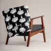 Throw blanket with image of middle finger silhouette printed all over. The blanket is black and the graphic is white. Shown draped over a chair.