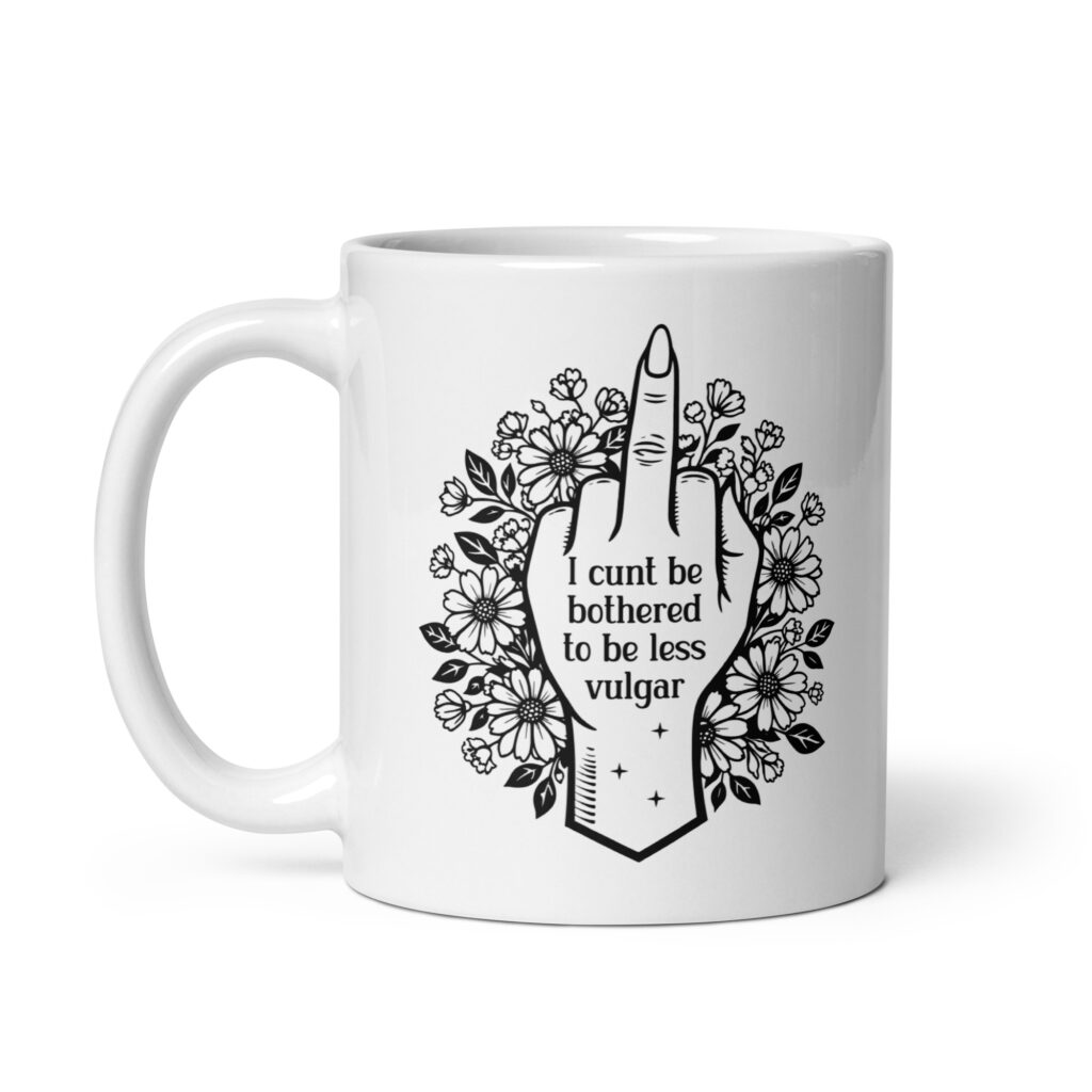 White ceramic mug with with a middle finger design on the front and the text 'I cunt be bothered to be less vulgar' printed on both sides.
