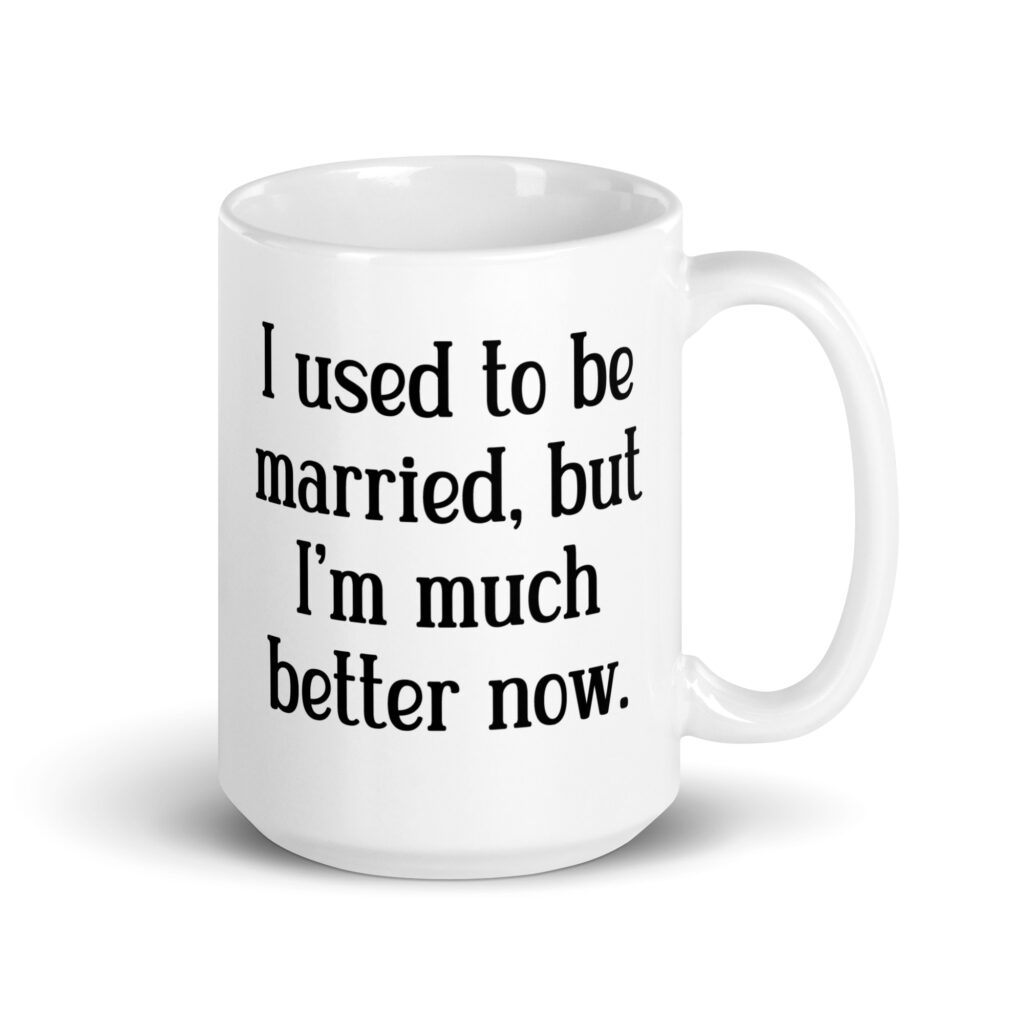 White ceramic mug with with the text "I used to be married, but I'm much better now" printed on both sides.