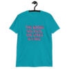 Tropical blue t-shirt with the text 'The boobs are real, the smile is fake.' printed in pink on the front.