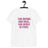 White t-shirt with the text 'The boobs are real, the smile is fake.' printed in pink on the front.