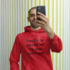 Man wearing a red hoodie sweatshirt with the text "I used to be married, but I'm much better now" printed on the front.