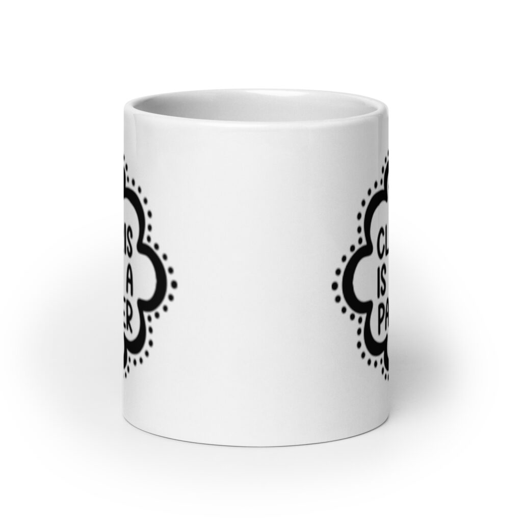 White ceramic mug with the text "The clitoris is not a pacifier" printed on both sides.