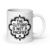 White ceramic mug with the text "The clitoris is not a pacifier" printed on both sides.