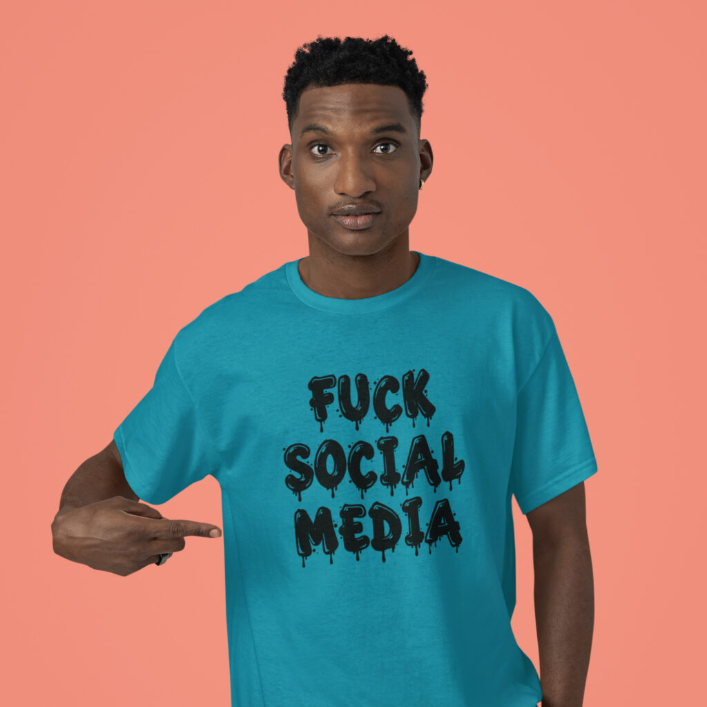Man wearing a tropical blue color t-shirt with the text 'Fuck social media' printed on the front in drippy graffiti style font.