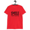 Red t-shirt with the text 'SMILE if you're a good boy' printed on the front.