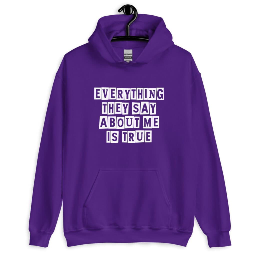 Purple hoodie sweatshirt with the text 'Everything they say about me is true' printed on the front.