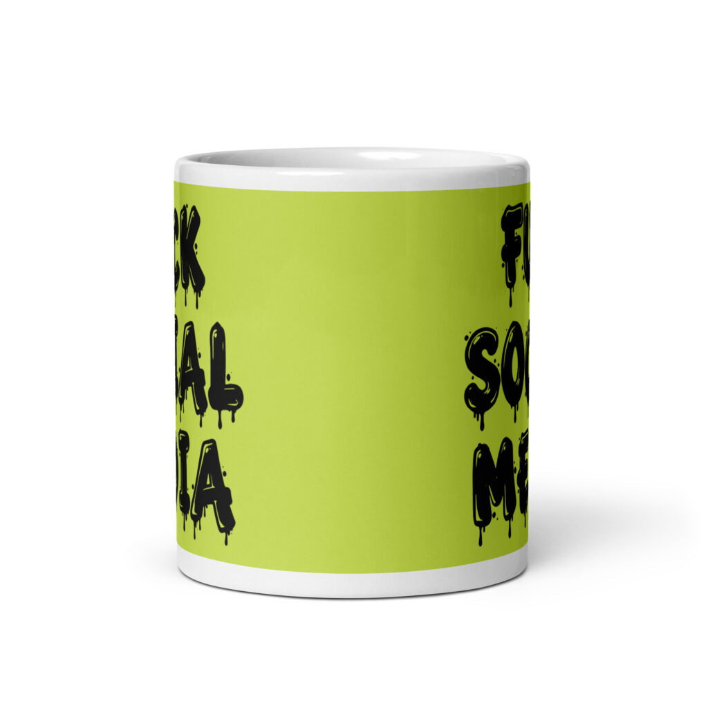 White and lime green ceramic coffee mug with the text 'Fuck social media' printed on the front in drippy graffiti style font on both sides of the mug.
