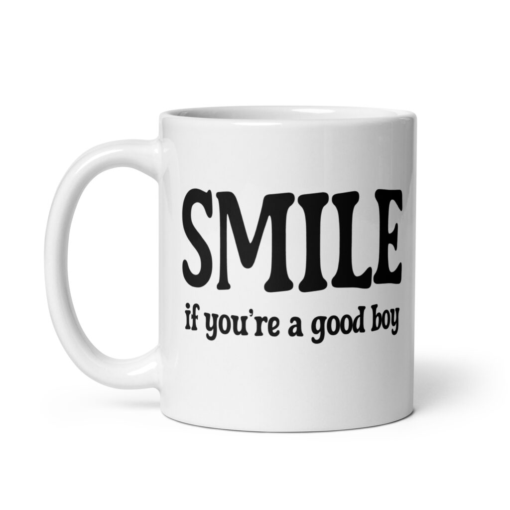 White ceramic mug with the text 'SMILE if you're a good boy' printed on both sides in black,
