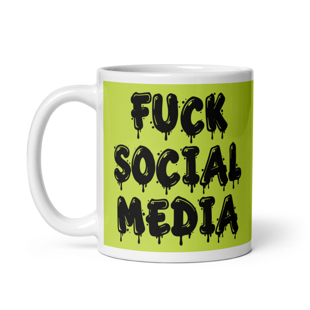 White and lime green ceramic coffee mug with the text 'Fuck social media' printed on the front in drippy graffiti style font on both sides of the mug.