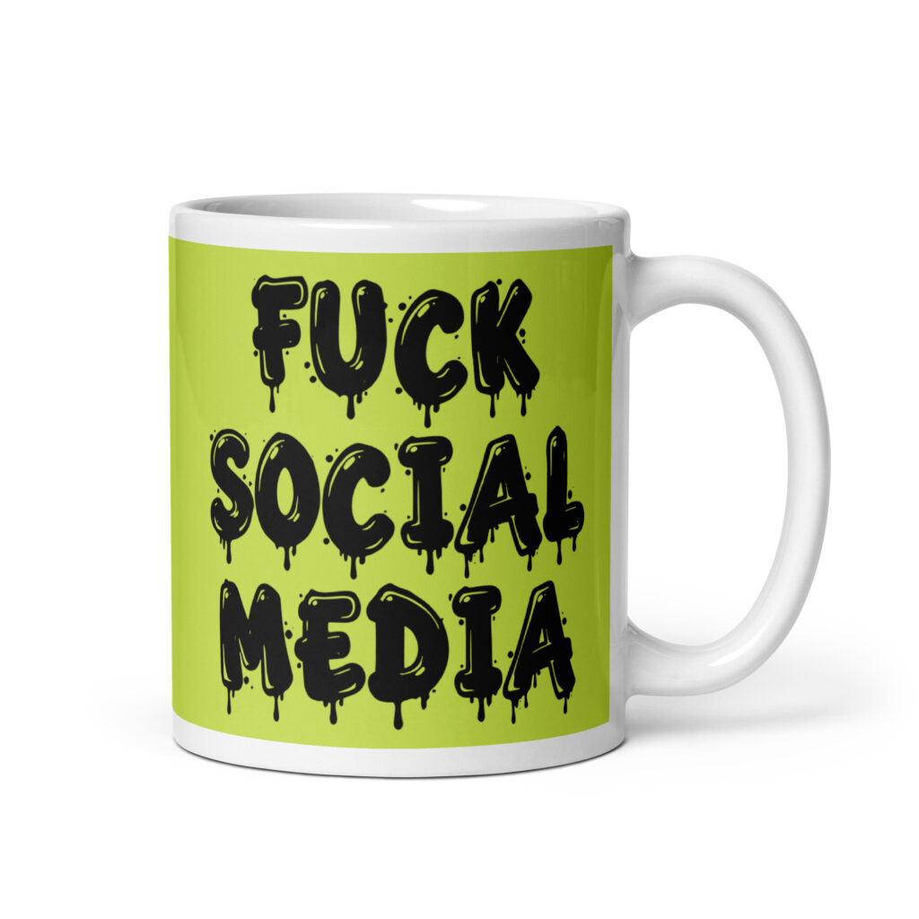 White and lime green ceramic coffee mug with the text 'Fuck social media' printed on the front in drippy graffiti style font on both sides of the mug.