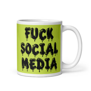 White and lime green ceramic coffee mug with the text 'Fuck social media' printed on the front in drippy graffiti style font on both sides of the mug.