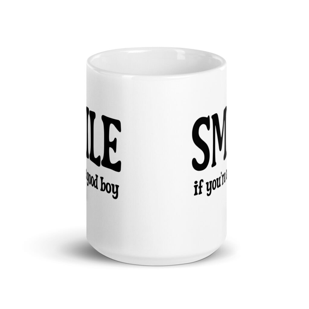 White ceramic mug with the text 'SMILE if you're a good boy' printed on both sides in black,