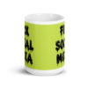 White and lime green ceramic coffee mug with the text 'Fuck social media' printed on the front in drippy graffiti style font on both sides of the mug.