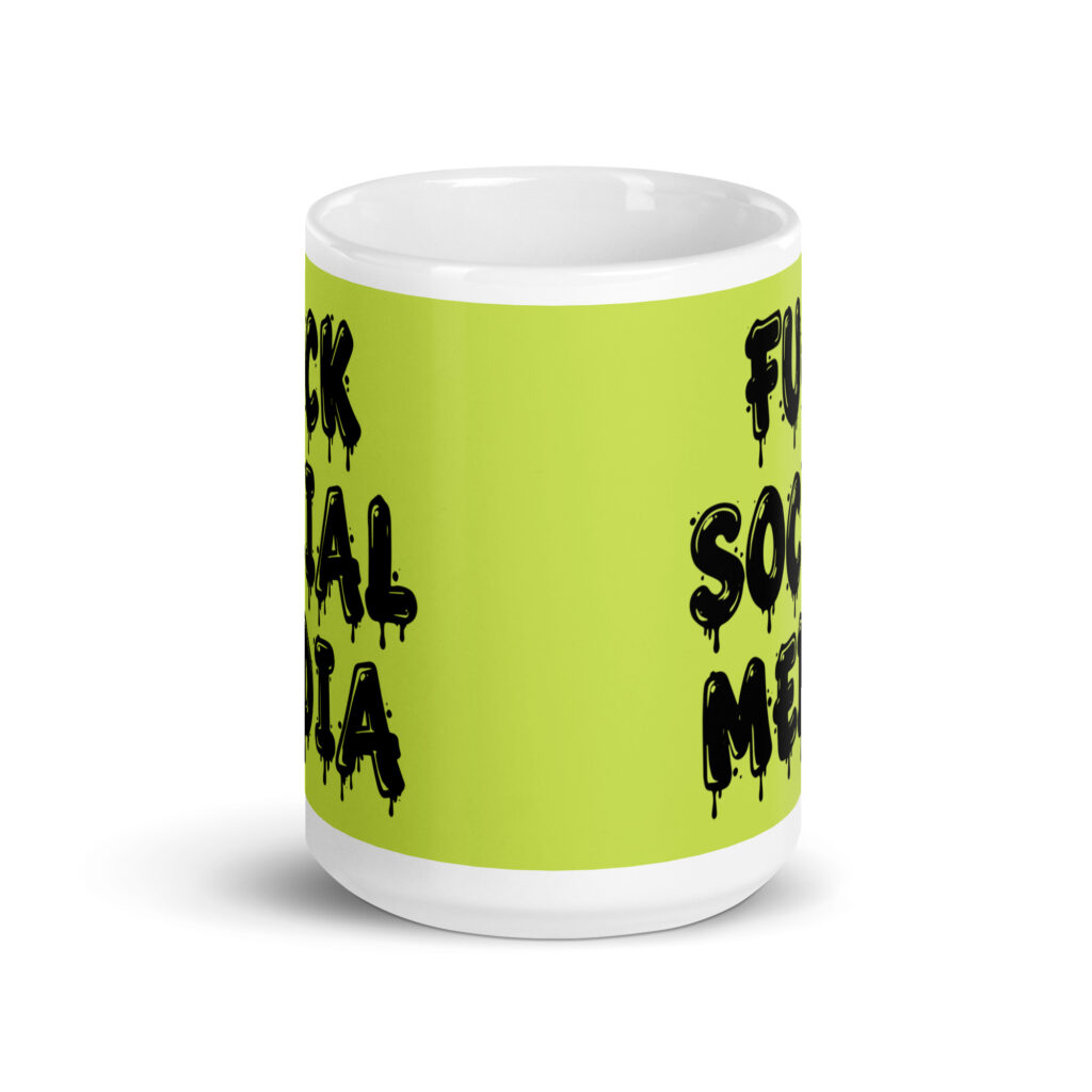 White and lime green ceramic coffee mug with the text 'Fuck social media' printed on the front in drippy graffiti style font on both sides of the mug.