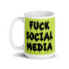 White and lime green ceramic coffee mug with the text 'Fuck social media' printed on the front in drippy graffiti style font on both sides of the mug.