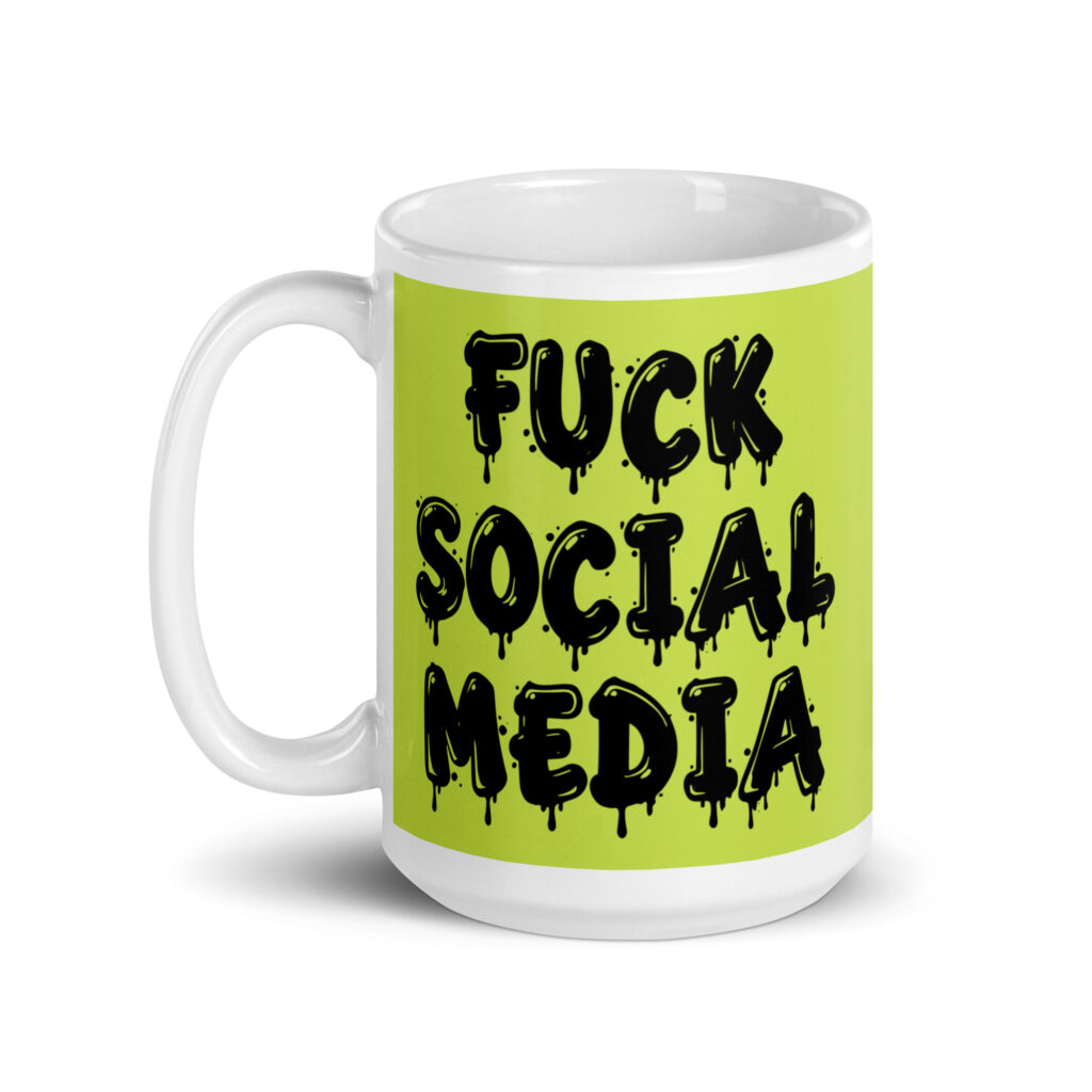 White and lime green ceramic coffee mug with the text 'Fuck social media' printed on the front in drippy graffiti style font on both sides of the mug.