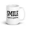 White ceramic mug with the text 'SMILE if you're a good boy' printed on both sides in black,