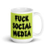 White and lime green ceramic coffee mug with the text 'Fuck social media' printed on the front in drippy graffiti style font on both sides of the mug.