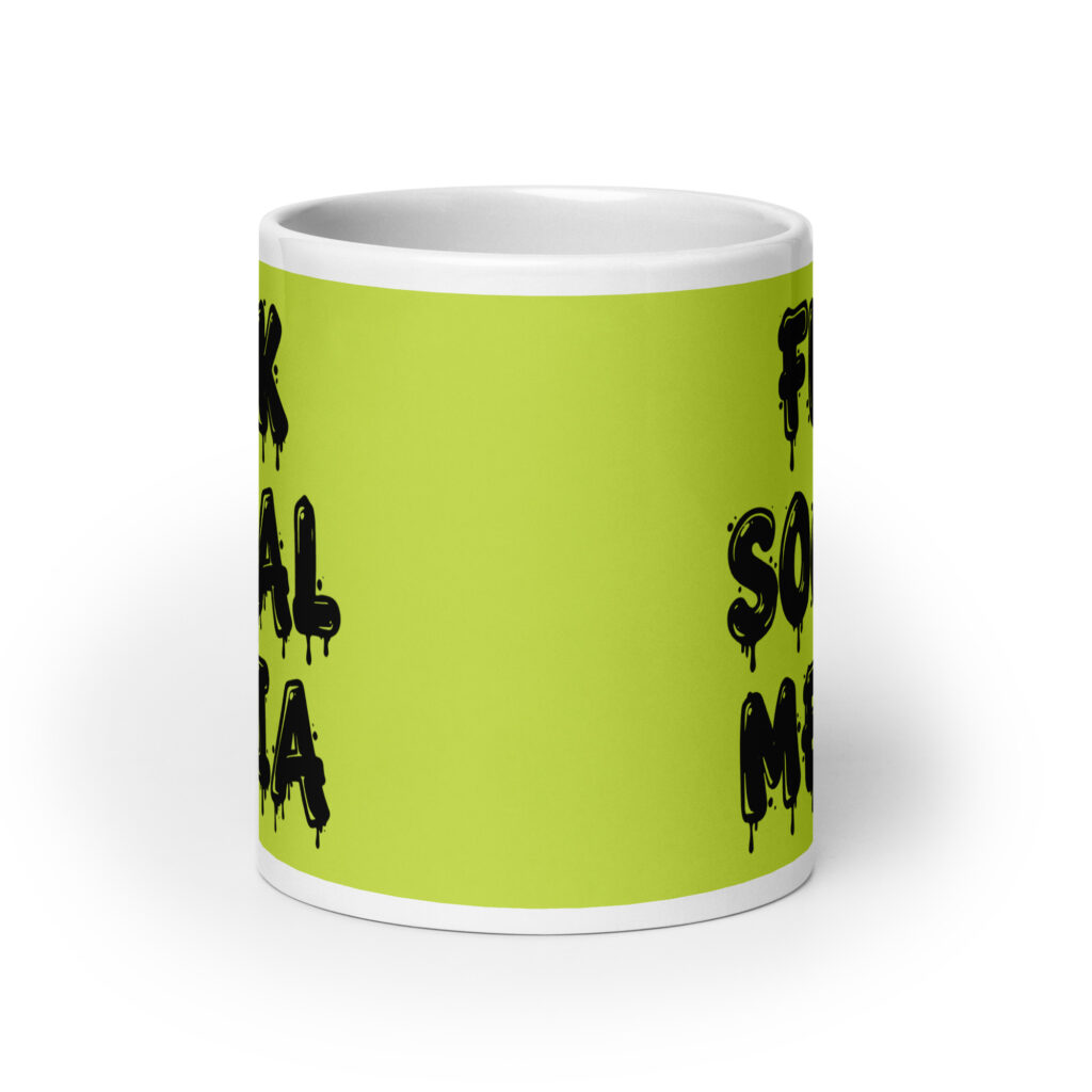White and lime green ceramic coffee mug with the text 'Fuck social media' printed on the front in drippy graffiti style font on both sides of the mug.