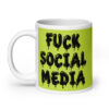 White and lime green ceramic coffee mug with the text 'Fuck social media' printed on the front in drippy graffiti style font on both sides of the mug.