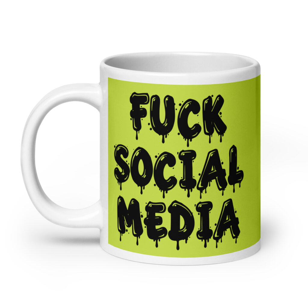 White and lime green ceramic coffee mug with the text 'Fuck social media' printed on the front in drippy graffiti style font on both sides of the mug.
