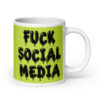 White and lime green ceramic coffee mug with the text 'Fuck social media' printed on the front in drippy graffiti style font on both sides of the mug.