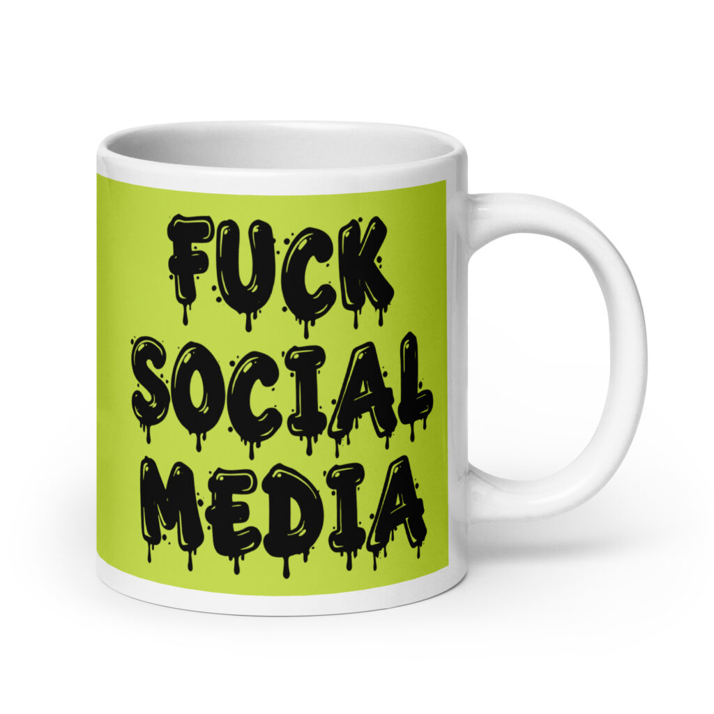 White and lime green ceramic coffee mug with the text 'Fuck social media' printed on the front in drippy graffiti style font on both sides of the mug.