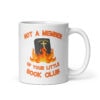 White ceramic mug with image of a burning bible and the text 'Not a member of your little book club' printed on both sides.