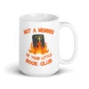 White ceramic mug with image of a burning bible and the text 'Not a member of your little book club' printed on both sides.