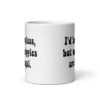 White ceramic mug with text 'I'd be topless, but my nipples are illegal.' printed on both sides in a floral font.