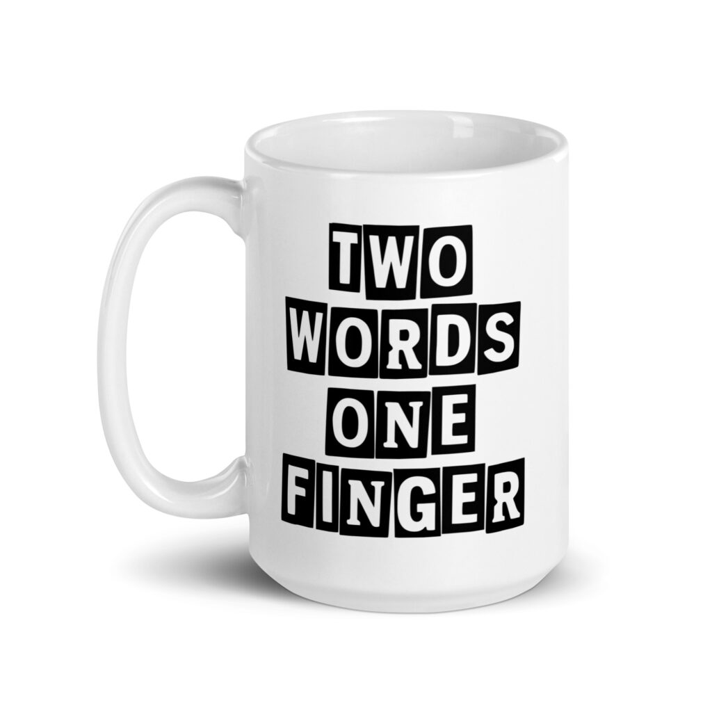 White ceramic mug with the text 'TWO WORDS ONE FINGER' printed in stencil font on both sides of the mug.