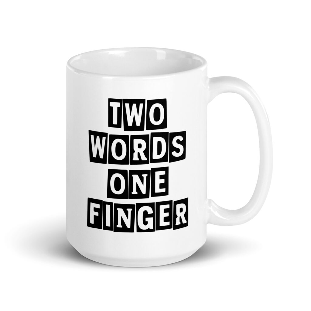 White ceramic mug with the text 'TWO WORDS ONE FINGER' printed in stencil font on both sides of the mug.