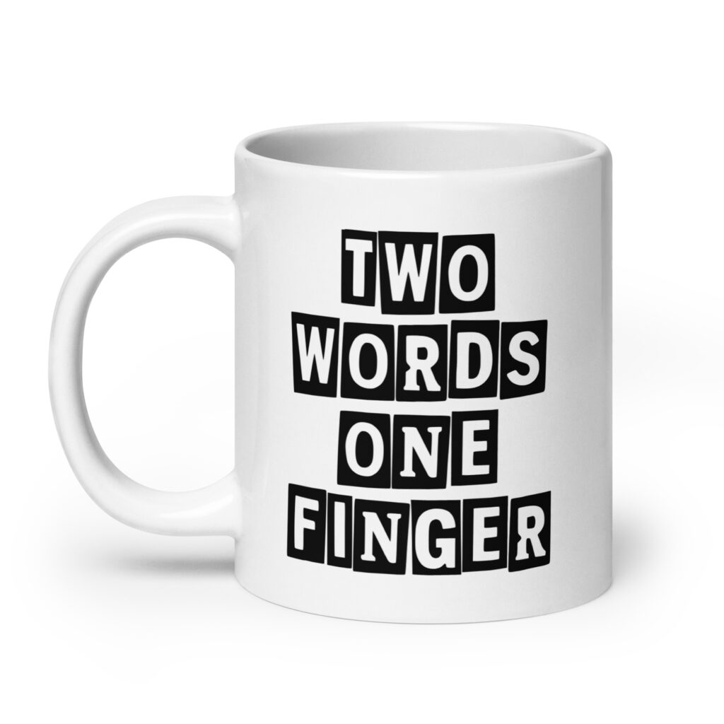 White ceramic mug with the text 'TWO WORDS ONE FINGER' printed in stencil font on both sides of the mug.