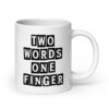 White ceramic mug with the text 'TWO WORDS ONE FINGER' printed in stencil font on both sides of the mug.