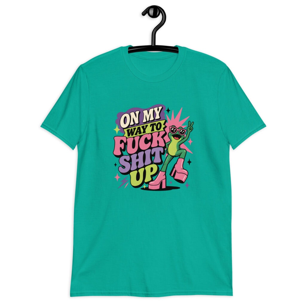 Jade color t-shirt with a retro frog and the phrase “On My Way to Fuck Shit Up” printed on the front.