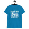 Sapphire blue t-shirt with bold white text reading ‘Adulting is a Scam’ in mixed block and distressed fonts. The design includes a smiley face, star, and flower icons, with a checkerboard stripe along the bottom.