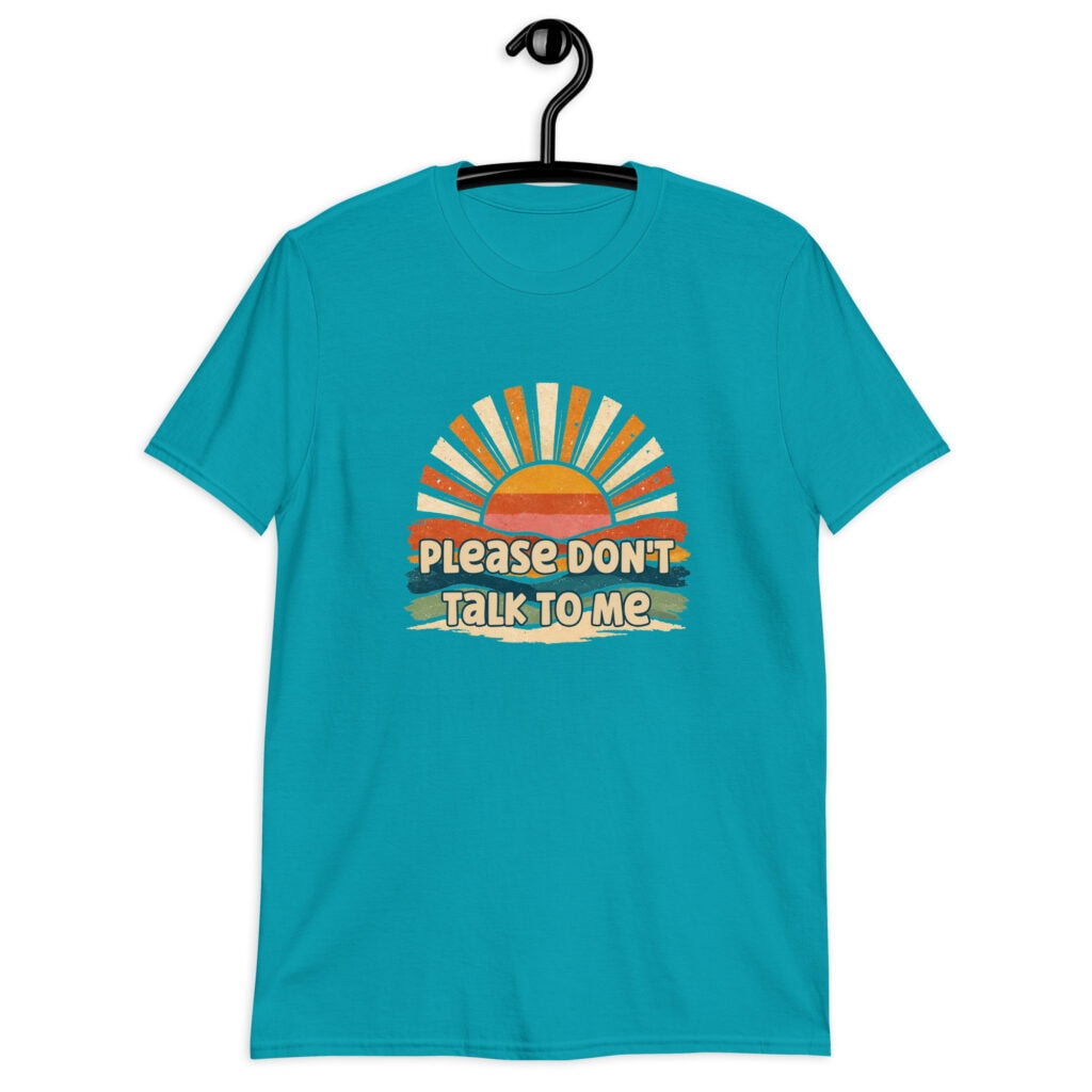 Tropical blue t-shirt with a retro sunrise design and the text 'Please don't talk to me' printed on the front.