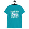 Tropical blue t-shirt with bold white text reading ‘Adulting is a Scam’ in mixed block and distressed fonts. The design includes a smiley face, star, and flower icons, with a checkerboard stripe along the bottom.