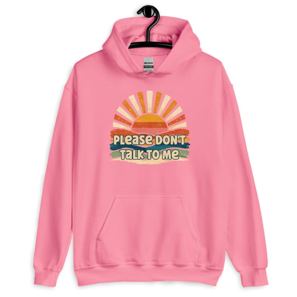 Azalea pink hoodie sweatshirt with a retro sunrise design and the text 'Please don't talk to me' printed on the front.
