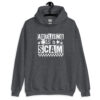 Dark heather grey hoodie sweatshirt with bold white text reading ‘Adulting is a Scam’ in mixed block and distressed fonts. The design includes a smiley face, star, and flower icons, with a checkerboard stripe along the bottom.