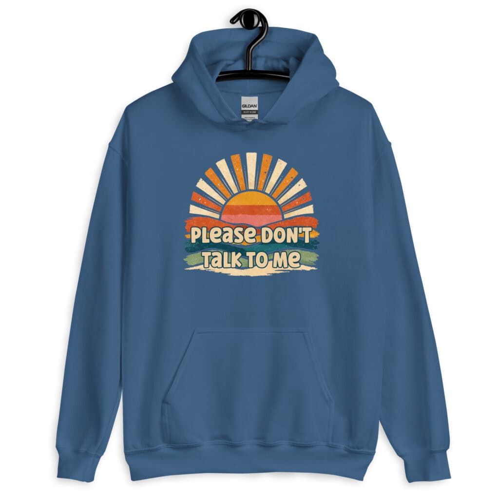 Indigo blue hoodie sweatshirt with a retro sunrise design and the text 'Please don't talk to me' printed on the front.