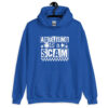 Royal blue hoodie sweatshirt with bold white text reading ‘Adulting is a Scam’ in mixed block and distressed fonts. The design includes a smiley face, star, and flower icons, with a checkerboard stripe along the bottom.