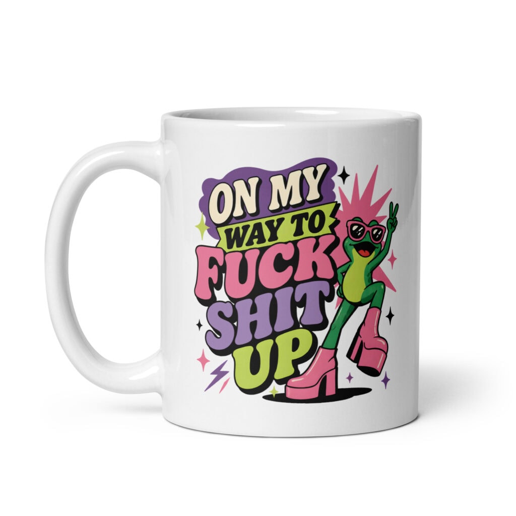 White mug with a retro frog and the phrase “On My Way to Fuck Shit Up.”